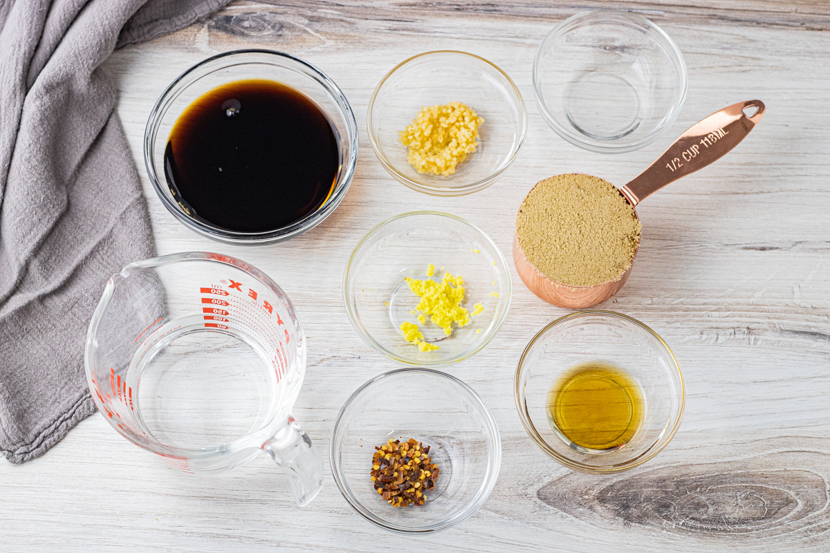small, glass bowls filled with ingredients for teriyaki sauce
