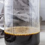 glass measuring cup filled with teriyaki sauce