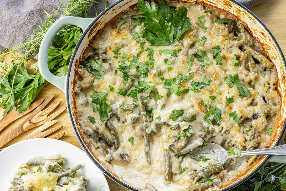 creamy green bean casserole with a spoonful out of the dish
