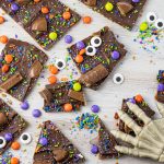 broken pieces of pretzel toffee covered with chocolate, sprinkles and candies