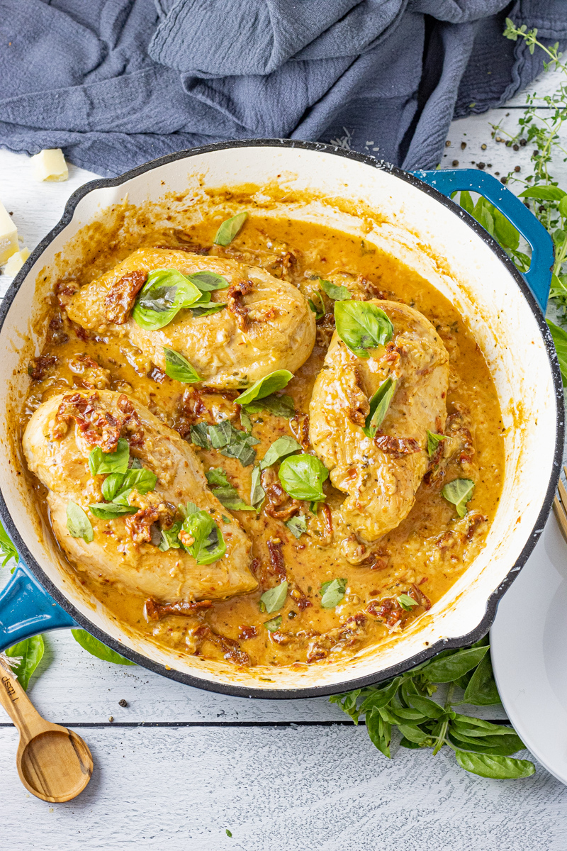 three chicken breast in a creamy tomato sauce