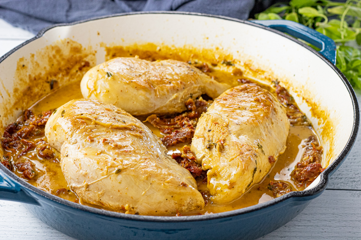 3 chicken breast in a creamy tomato sauce in a pan
