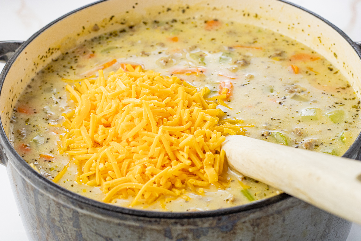 cheese on top of creamy sausage potato soup