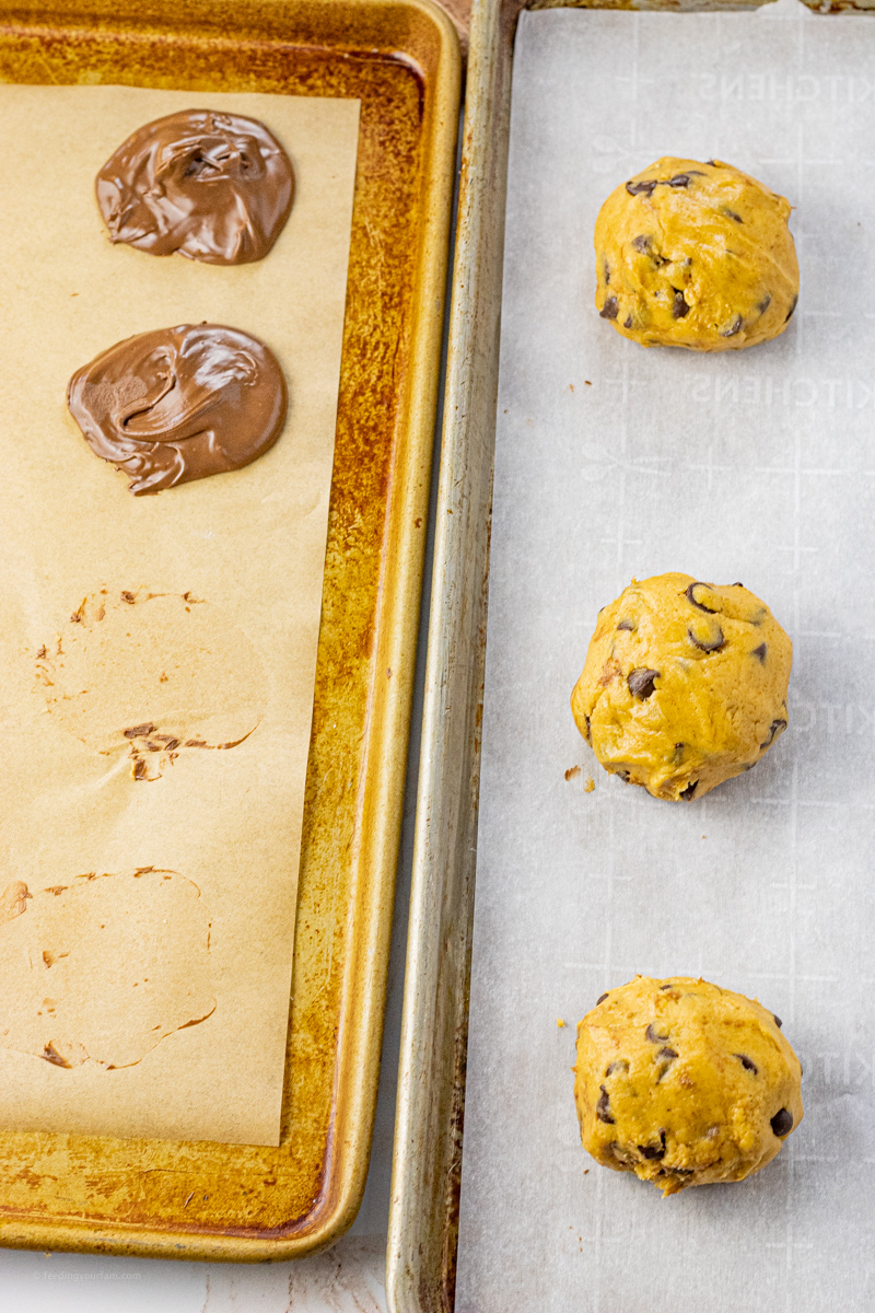 balls of pumpkin chocolate chip cookie dough next to scoops of chocolate spread