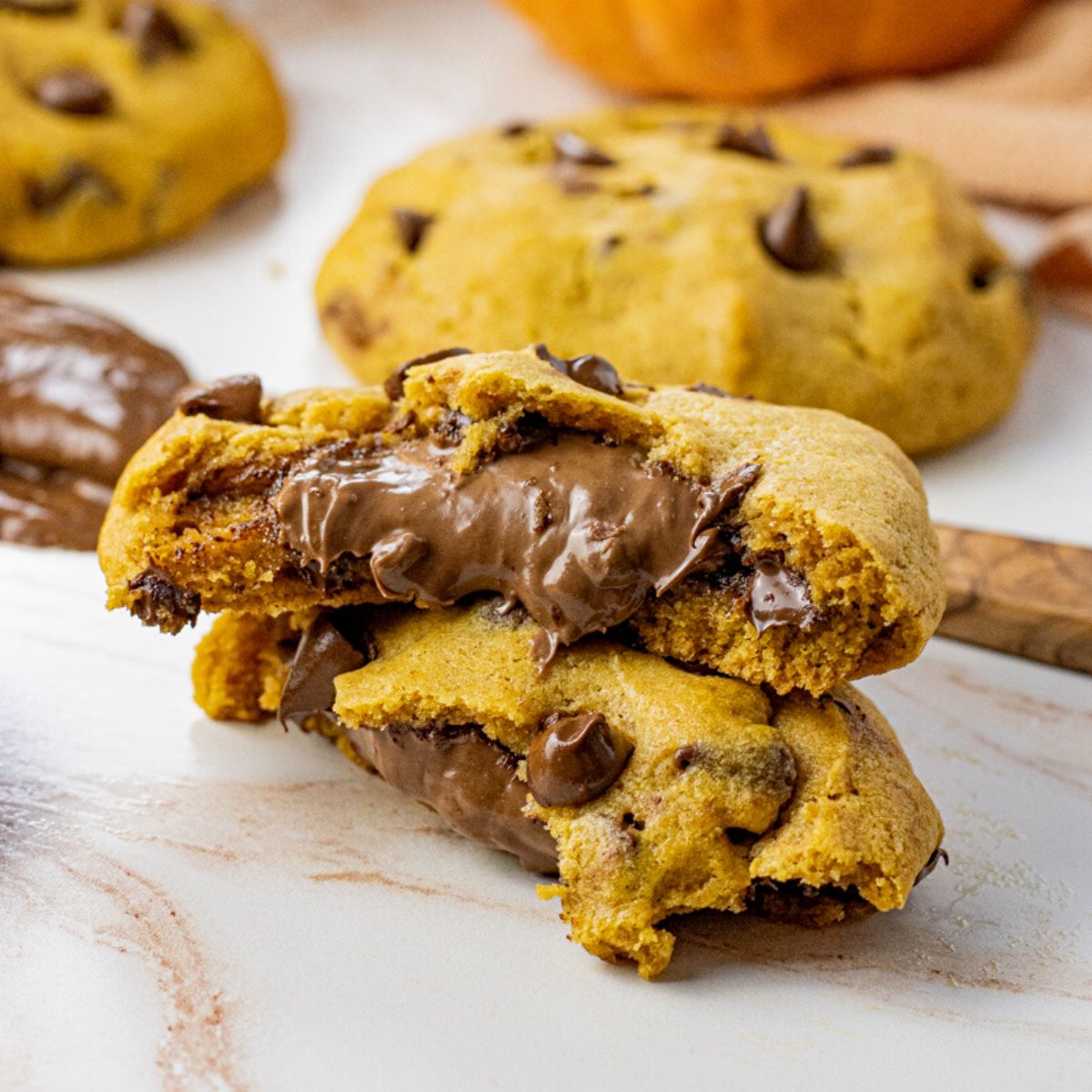 pumpkin chocolate chip cookies stuffed with melty chocolate