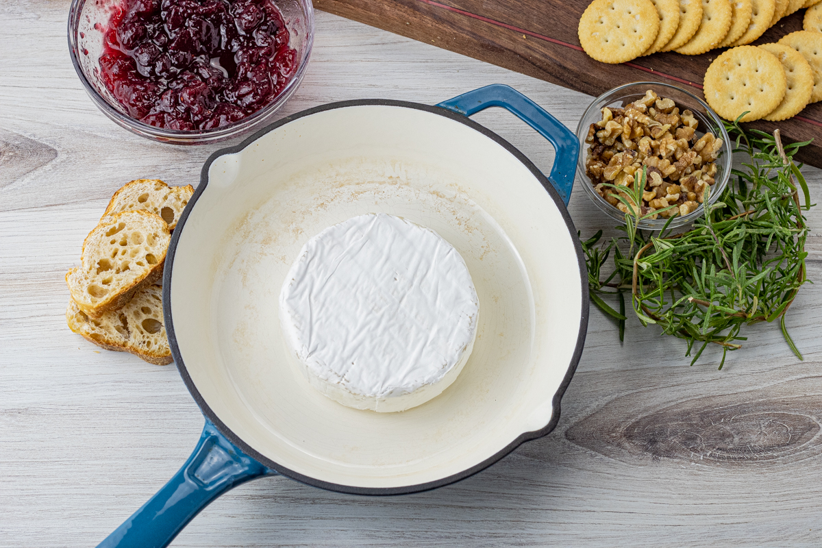 brie wheel in a small cast iron pan