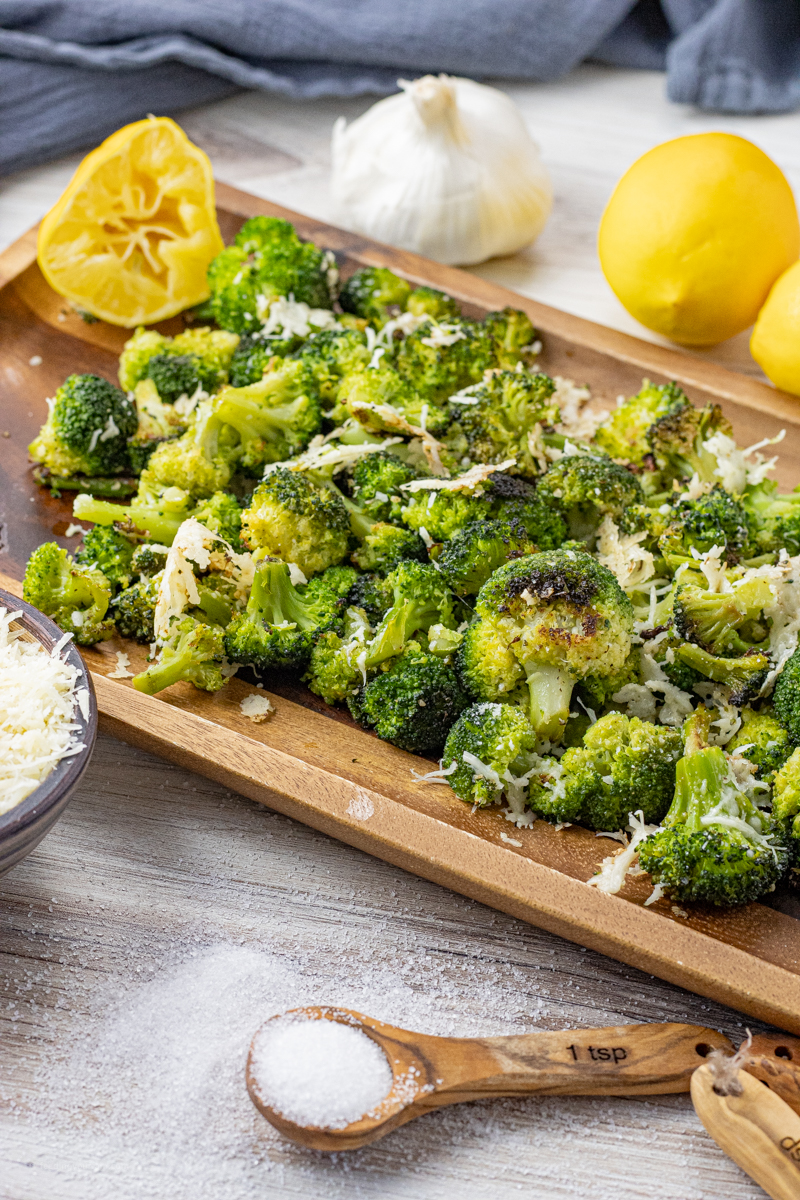 roasted broccoli on a wooden platter