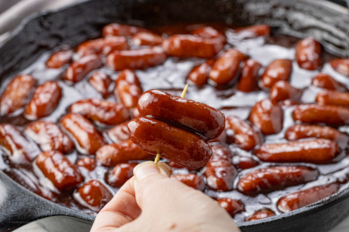 toothpick with two mini sausages on it