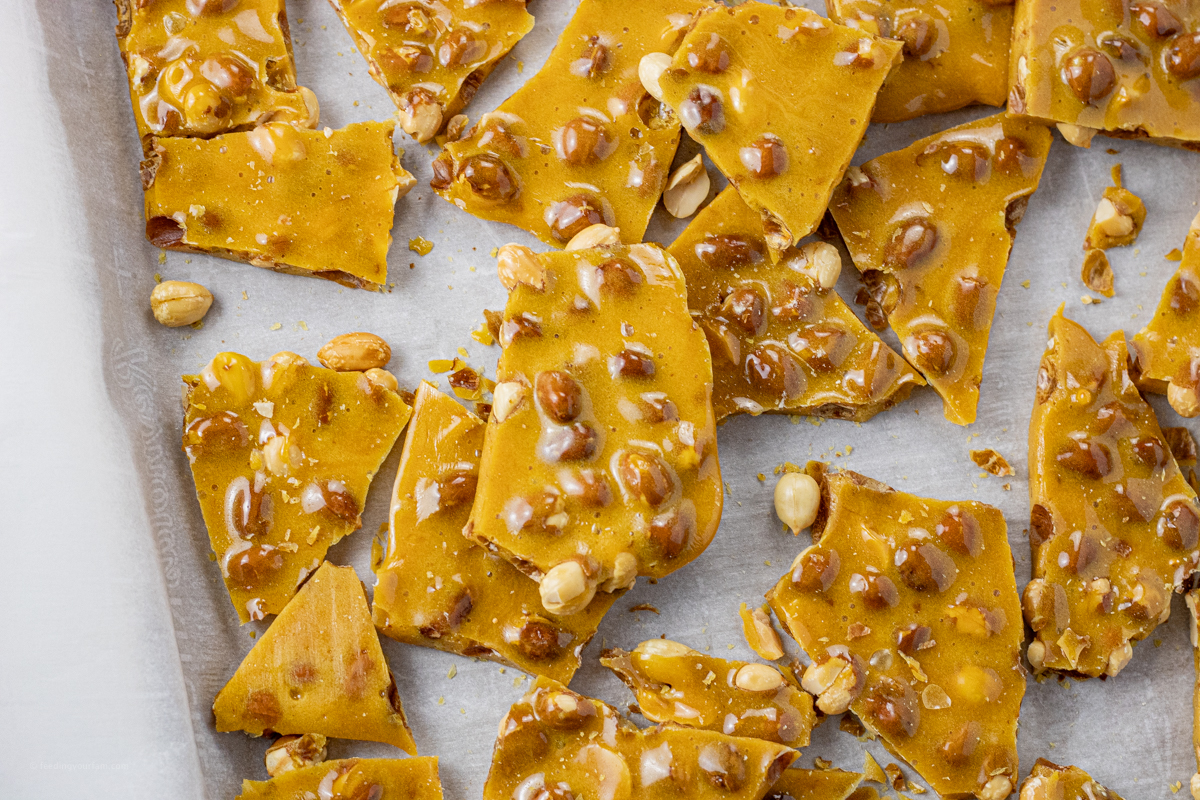 broke up pieces of peanut candy on a baking sheet