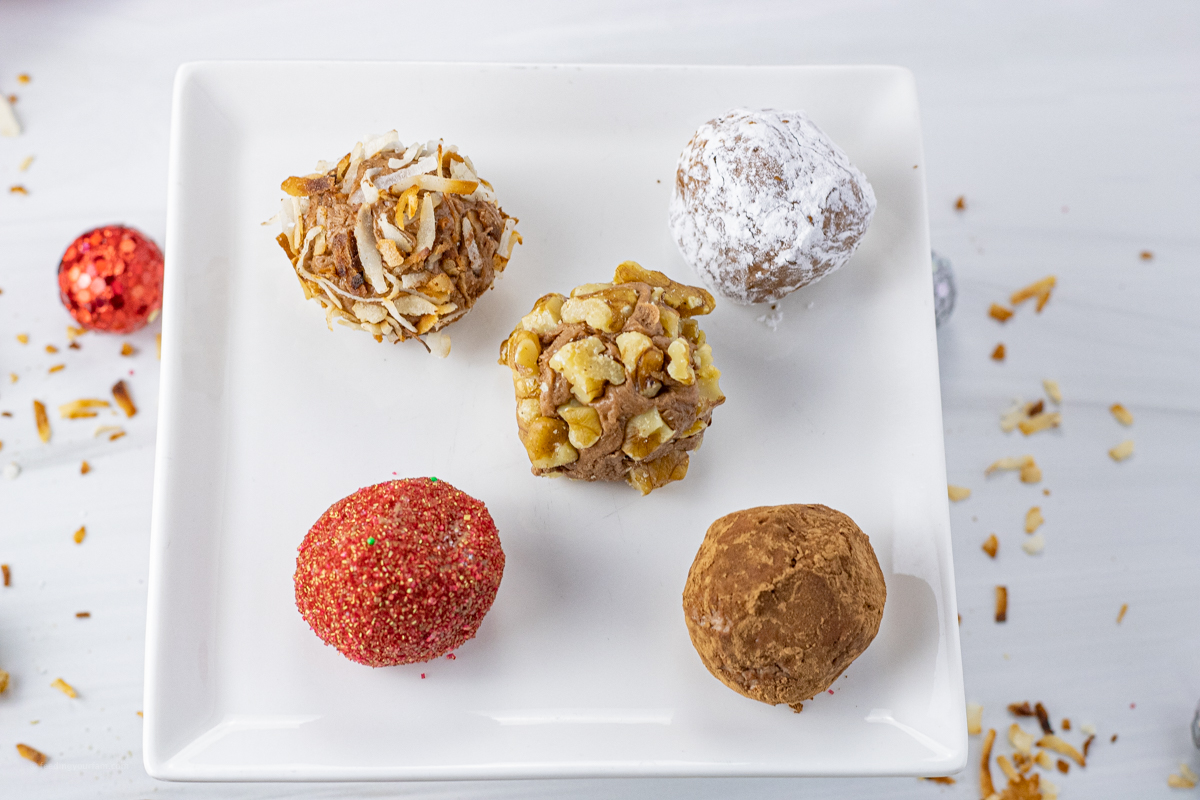 5 chocolate truffles on a small plate