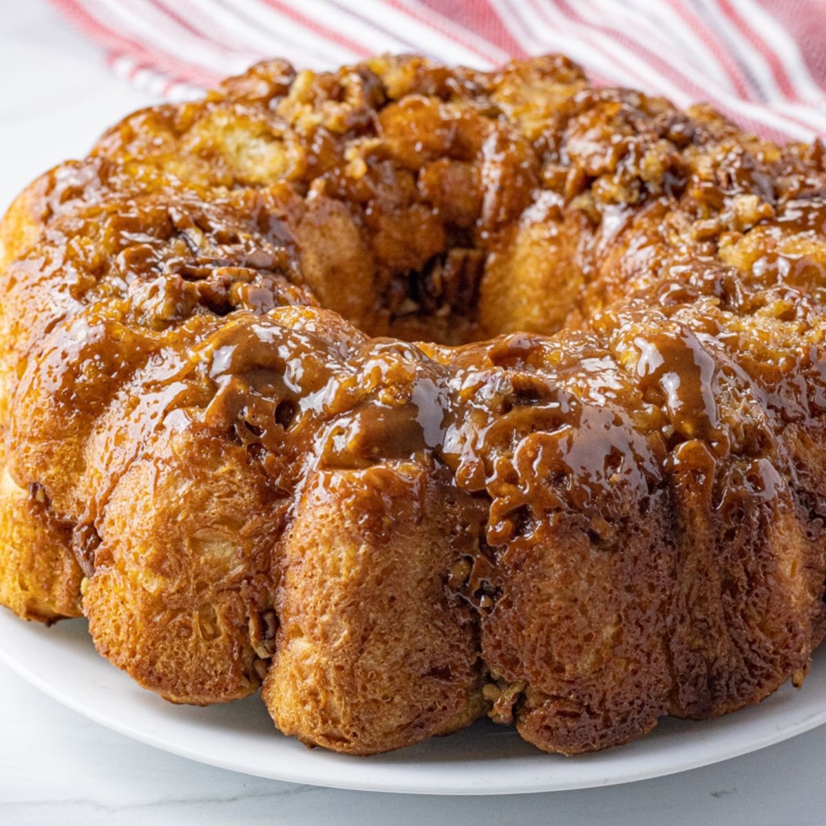 ring of bread topped with caramel and pecans