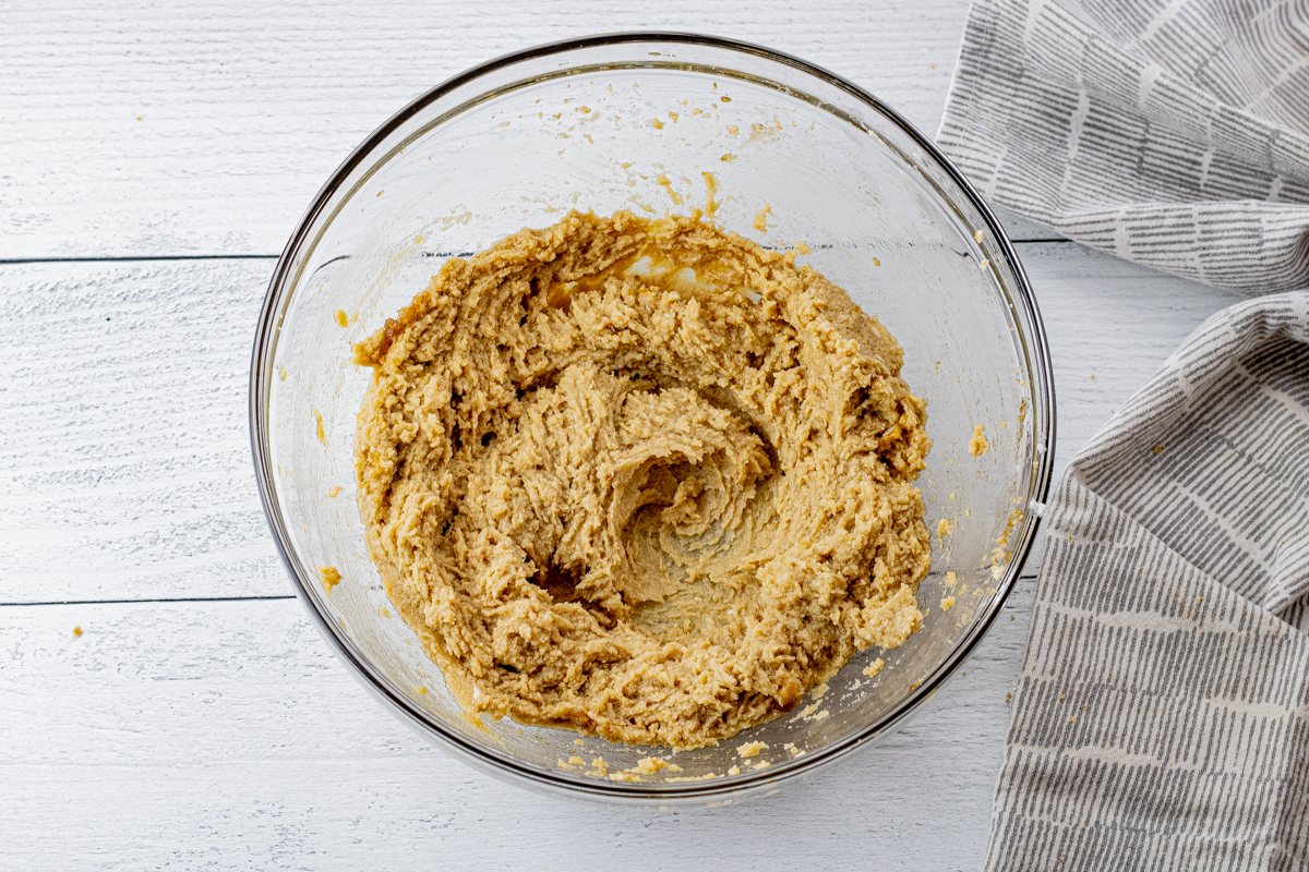 creamed butter and sugars in a glass mixing bowl