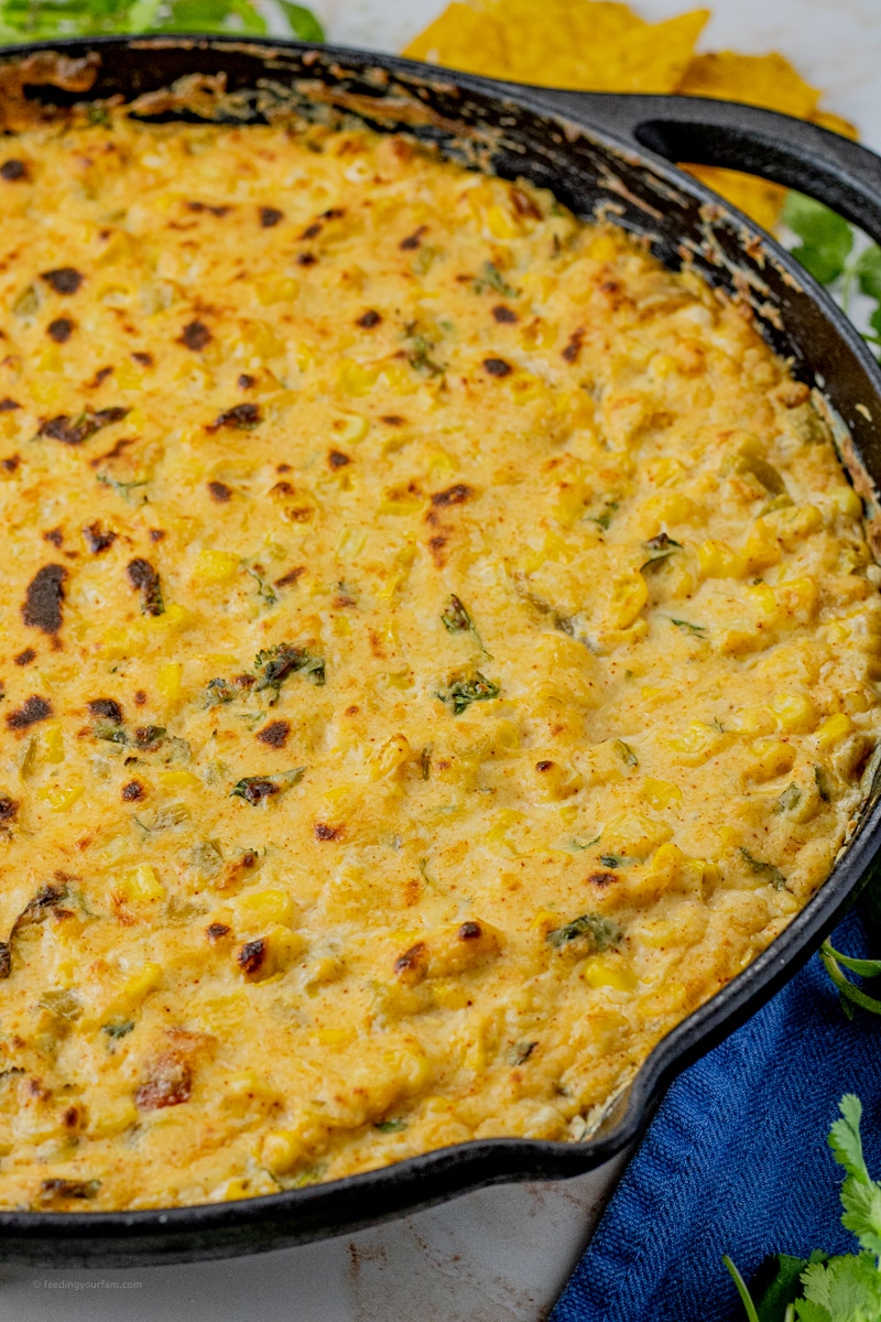 cheesy corn dip in a cast iron pan