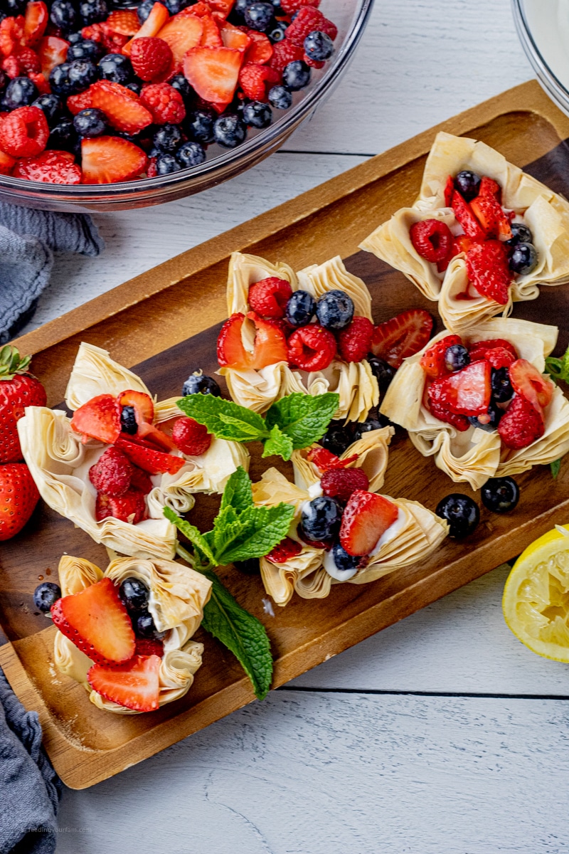 tarts filled with mixed berries and greek yogurt