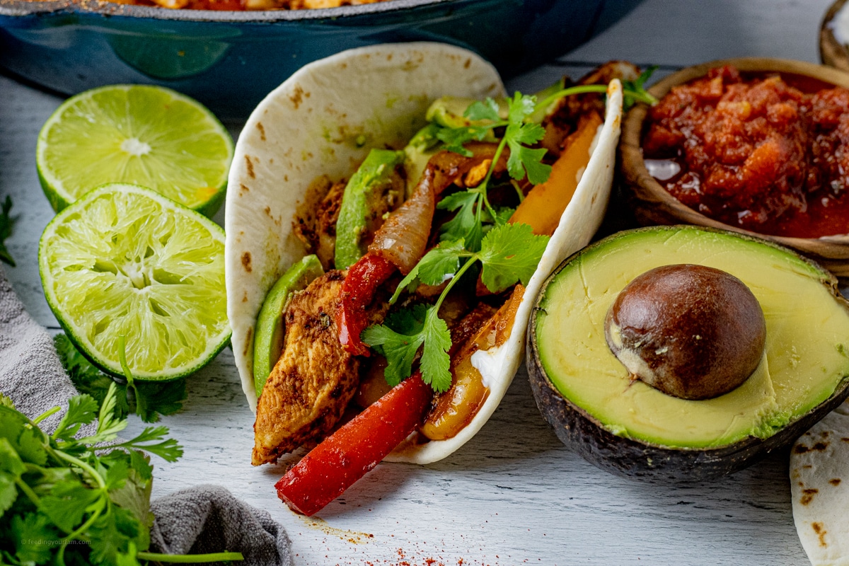 chicken fajita with peppers in a flour tortilla
