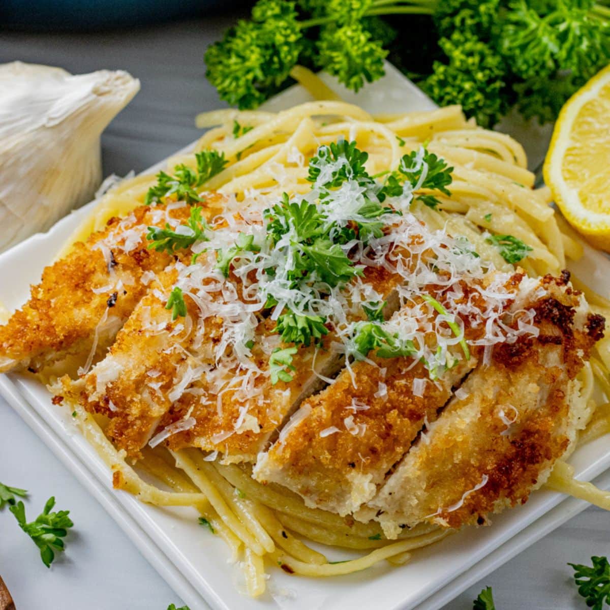 crunchy bread crumb coated chicken over pasta