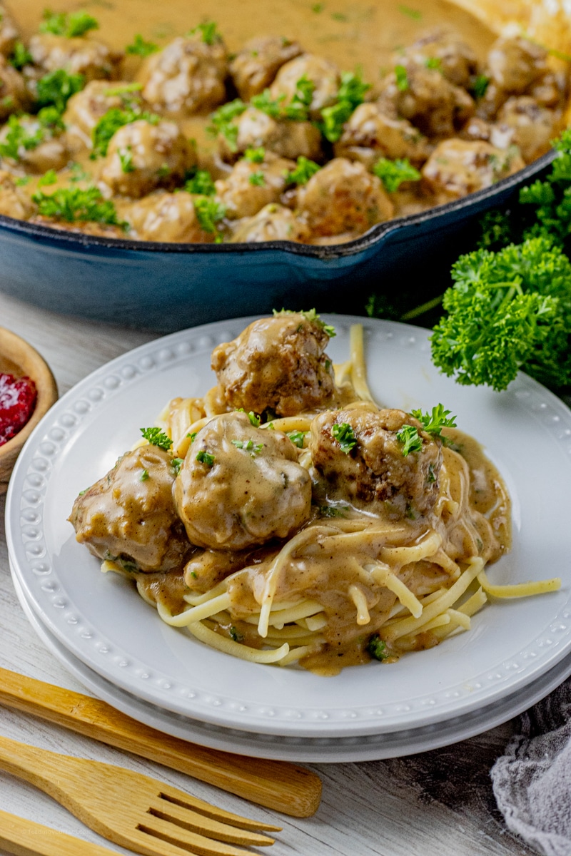 swedish meatballs in a gravy sauce over pasta
