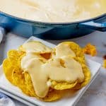 nacho cheese sauce on round tortilla chips