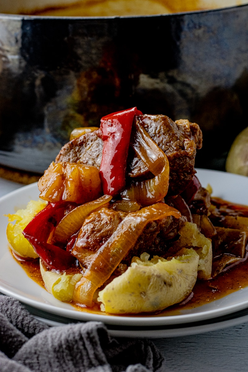 cooked boneless pork ribs on top of potatoes