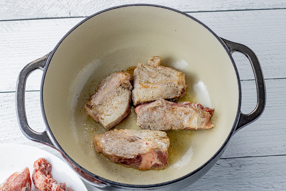 browned boneless pork ribs in a heavy pot