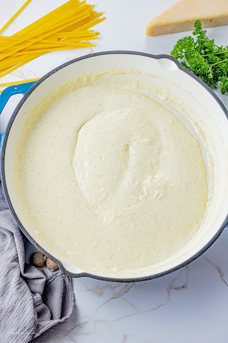 Big pan with creamy alfredo sauce