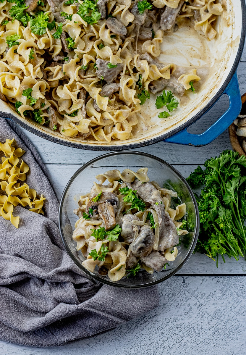 pan with beef stroganoff and small bowl with some dished into it
