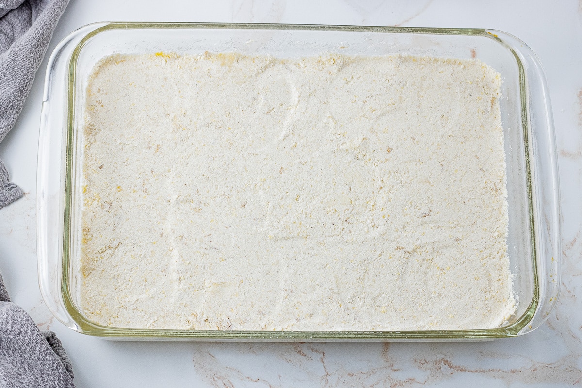 shortbread crust in the bottom of a glass baking dish, unbaked