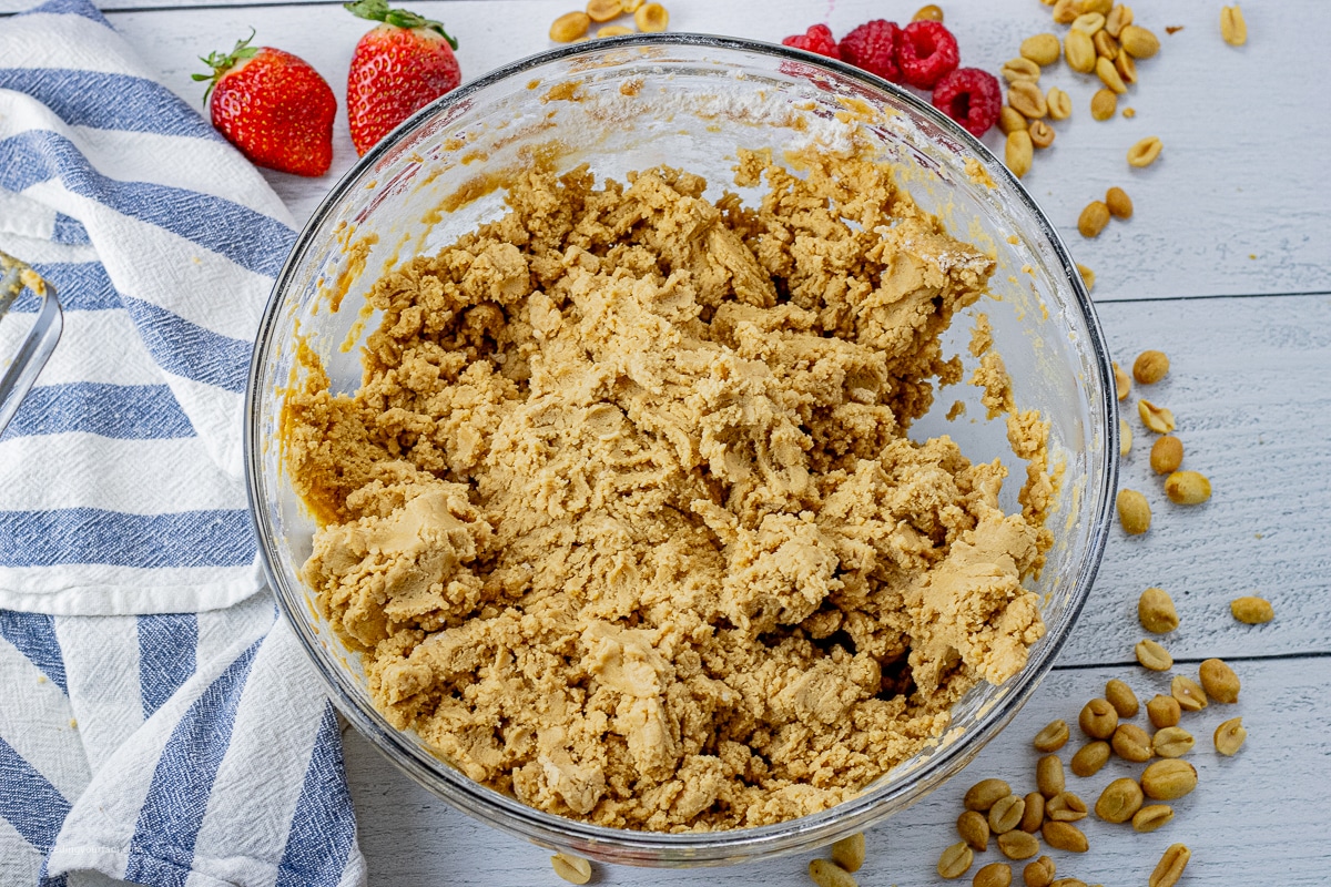 peanut butter cookie dough in a glass mixing bowl