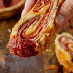 slice of stromboli with pizza sauce on it