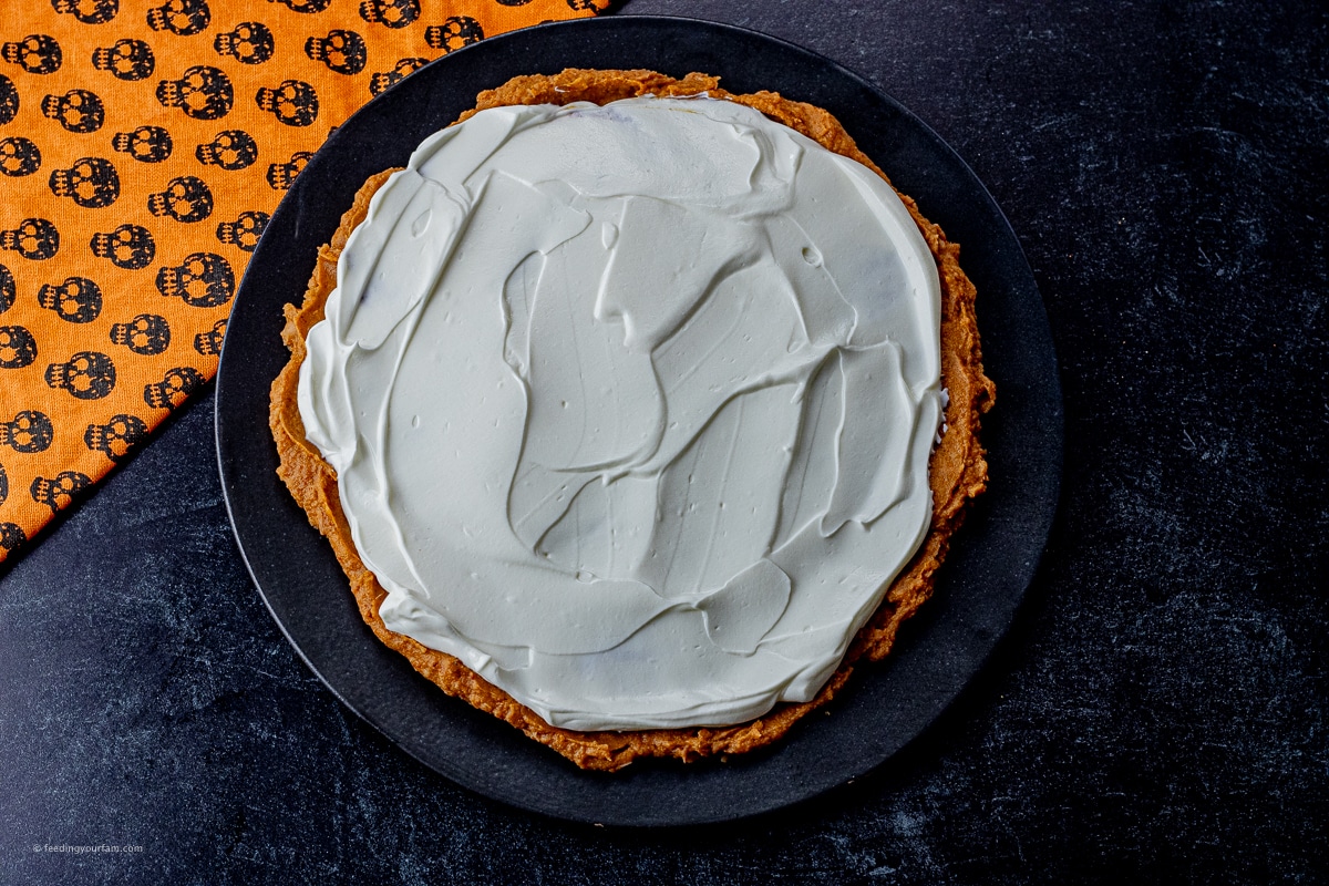 layer of refried beans topped with a layer of sour cream