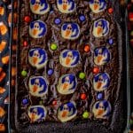 brownies topped with ghost cookies and colorful candies