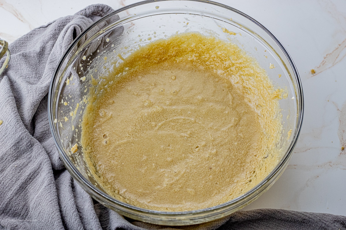 glass mixing bowl with butter, brown sugar, maple syrup, egg and vanilla