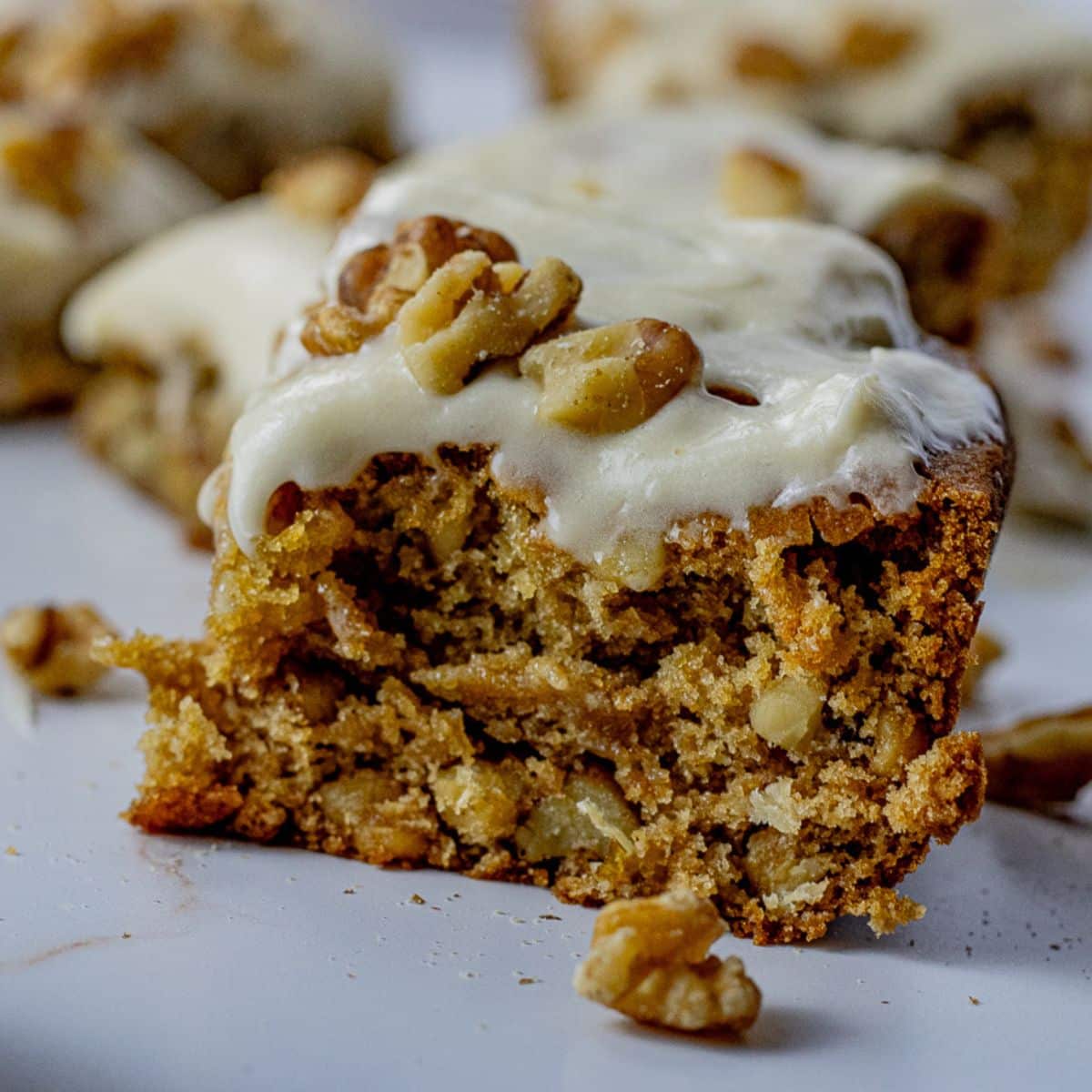 up close slice of maple cake with walnuts