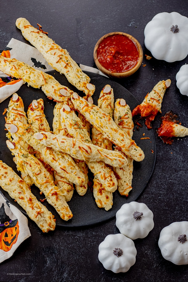 cheesy breadsticks made into witch fingers