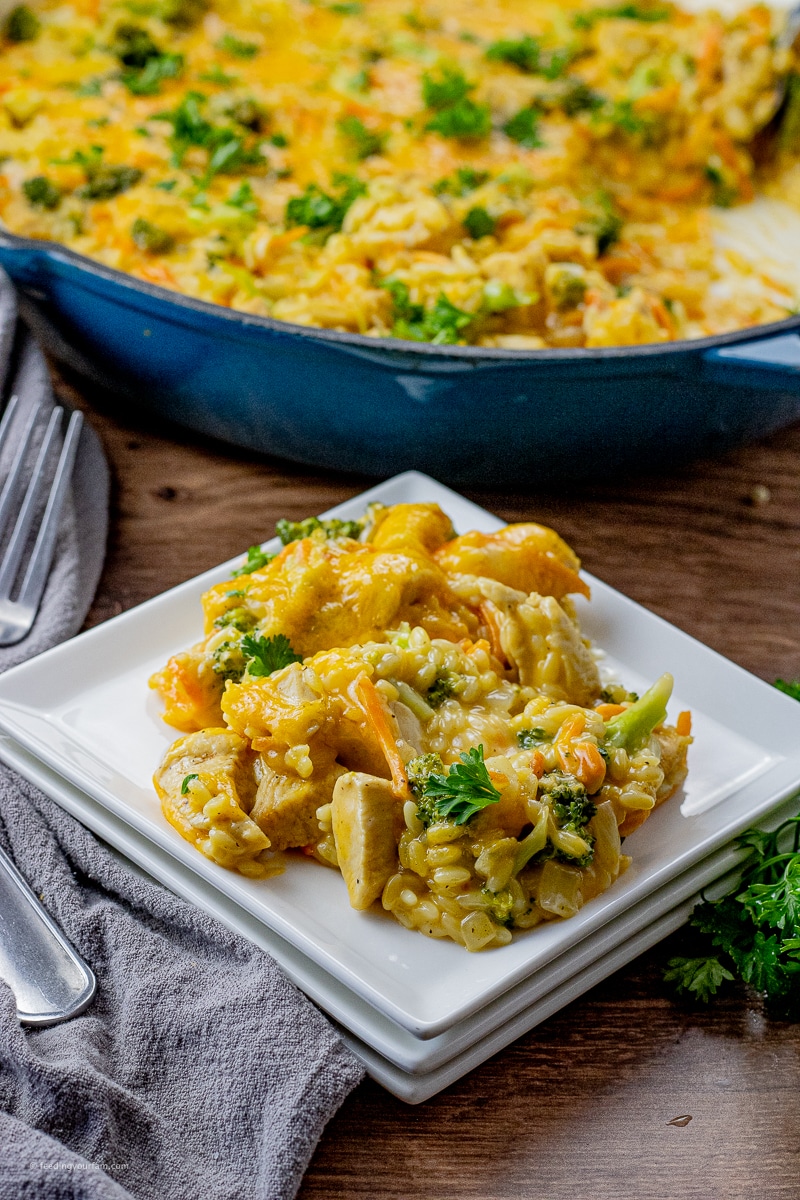 orzo with chicken and broccoli in a cheesy sauce on a white, square plate