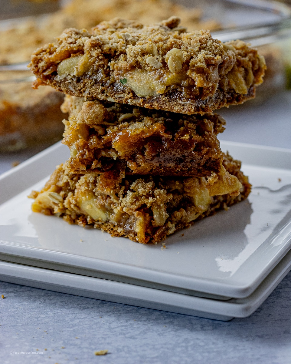caramel apple bars stacked in a pile of three