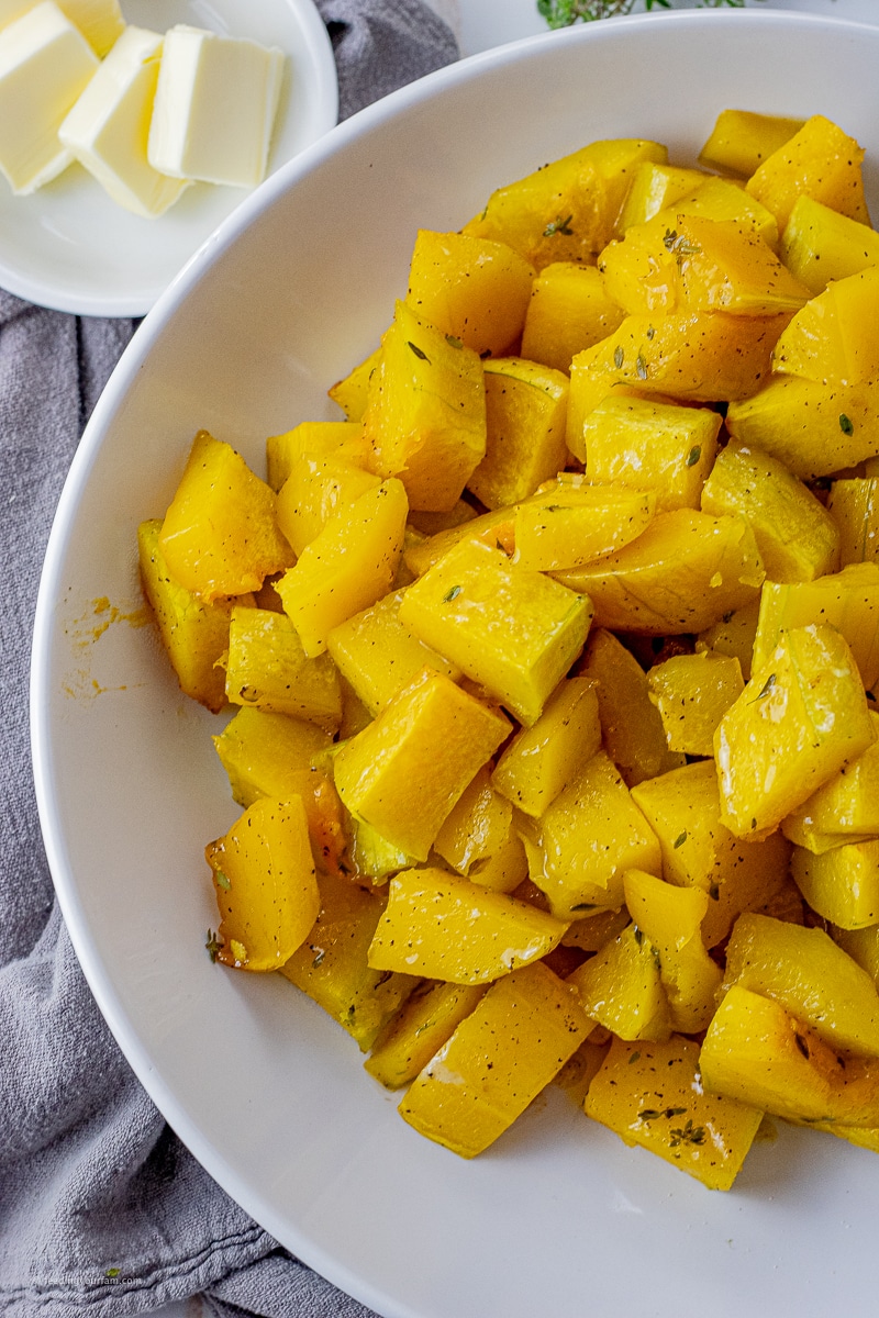 small pieces of cooked butternut squash in a white bowl