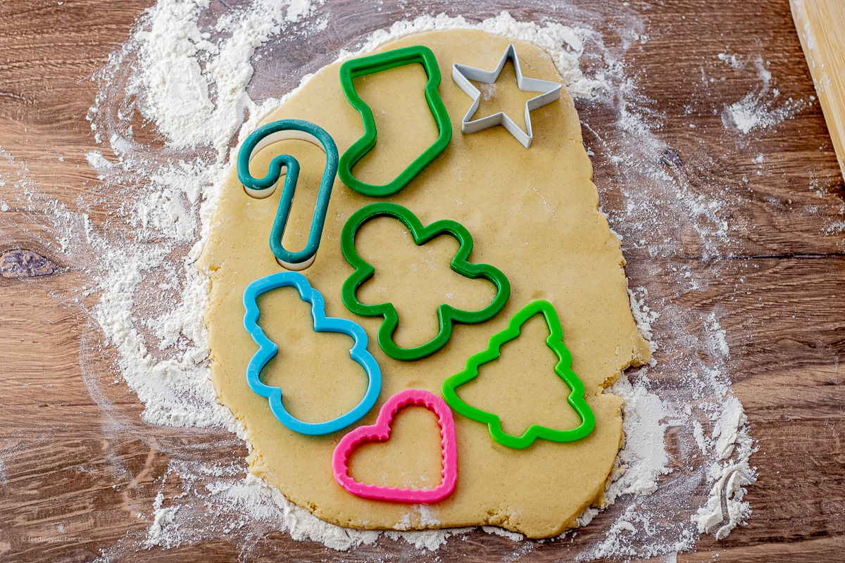 cookie dough rolled out with cookie cutter on top