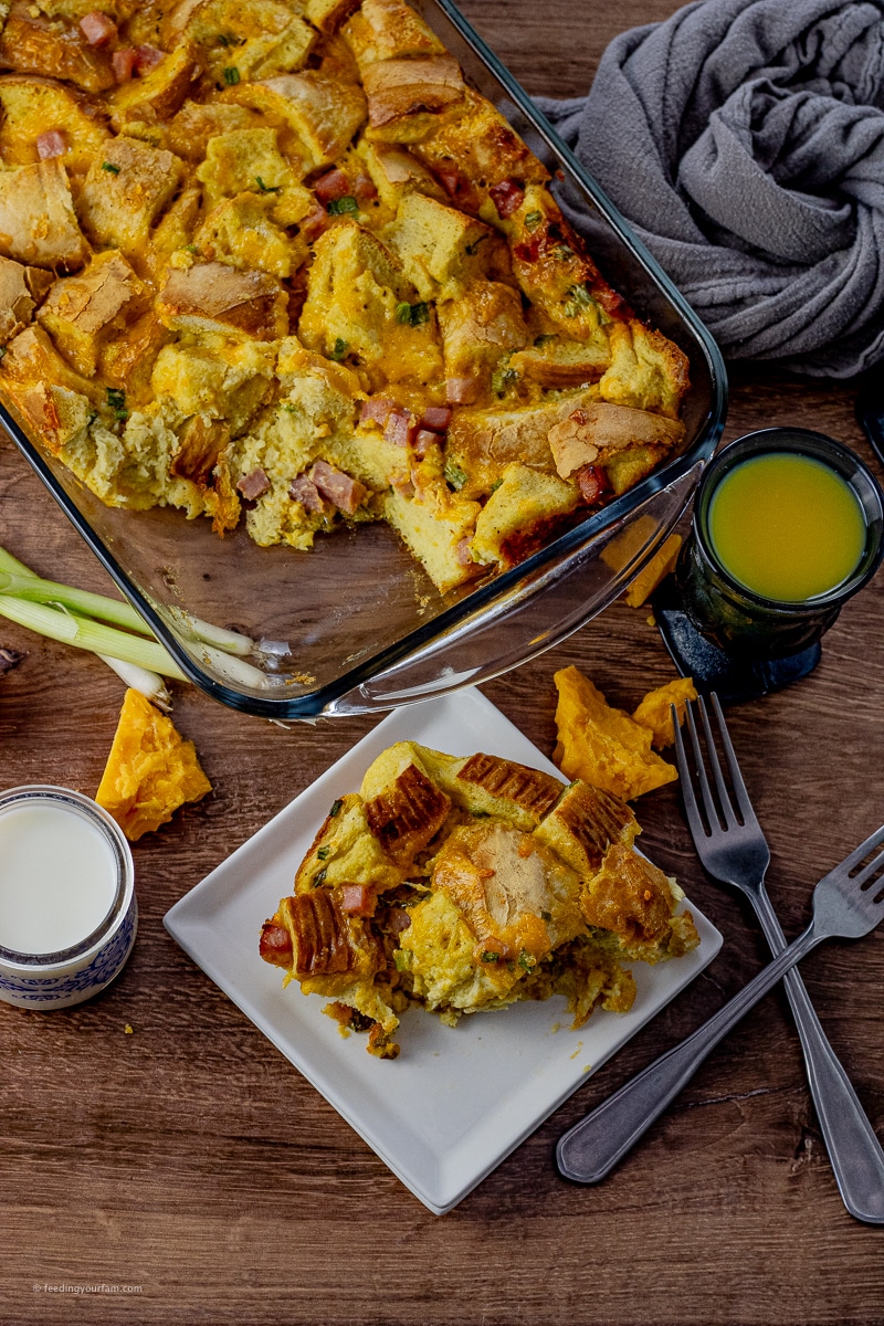 breakfast casserole with chunks of bread, eggs, ham and cheese