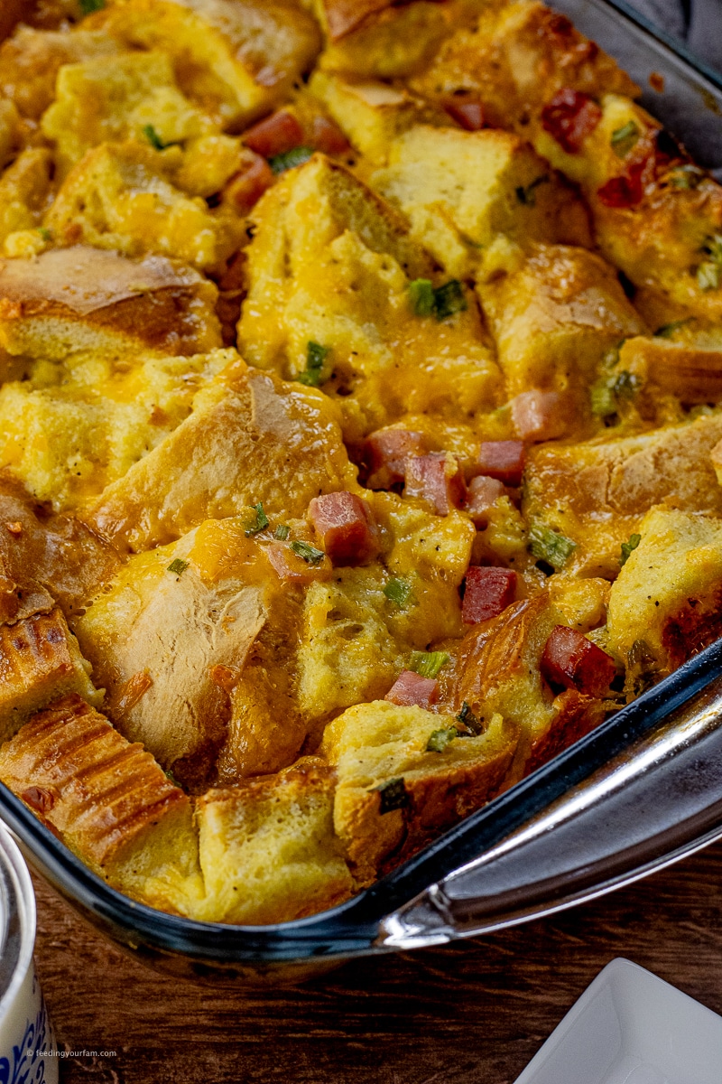 breakfast casserole made with chunks of bread, ham, cheese and eggs.