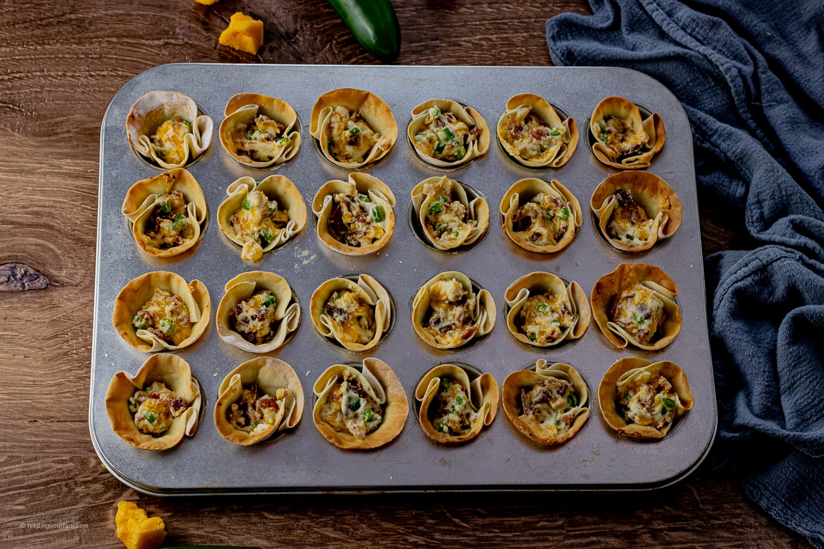 cooked jalapeno popper bites made in gyoza wrappers with a cream cheese filling