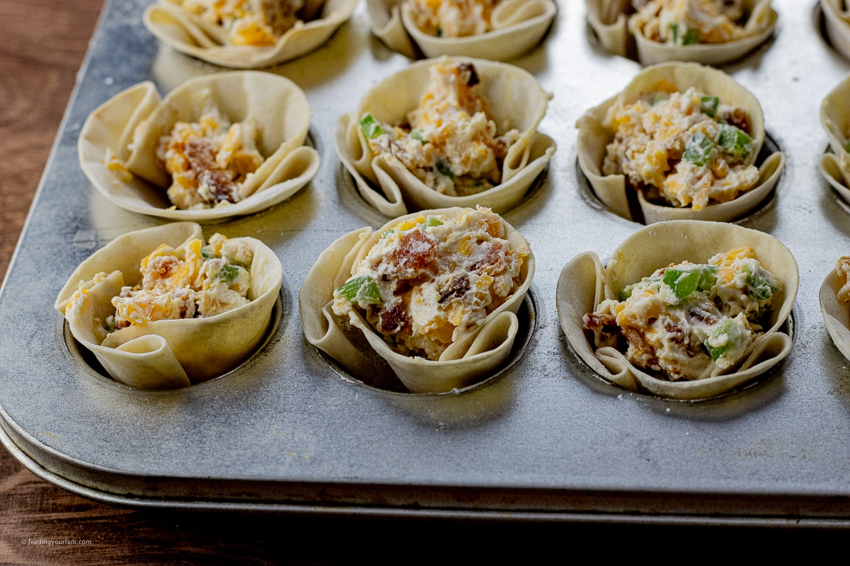 uncooked gyoza wrapper filled with jalapeno popper cream cheese mixture