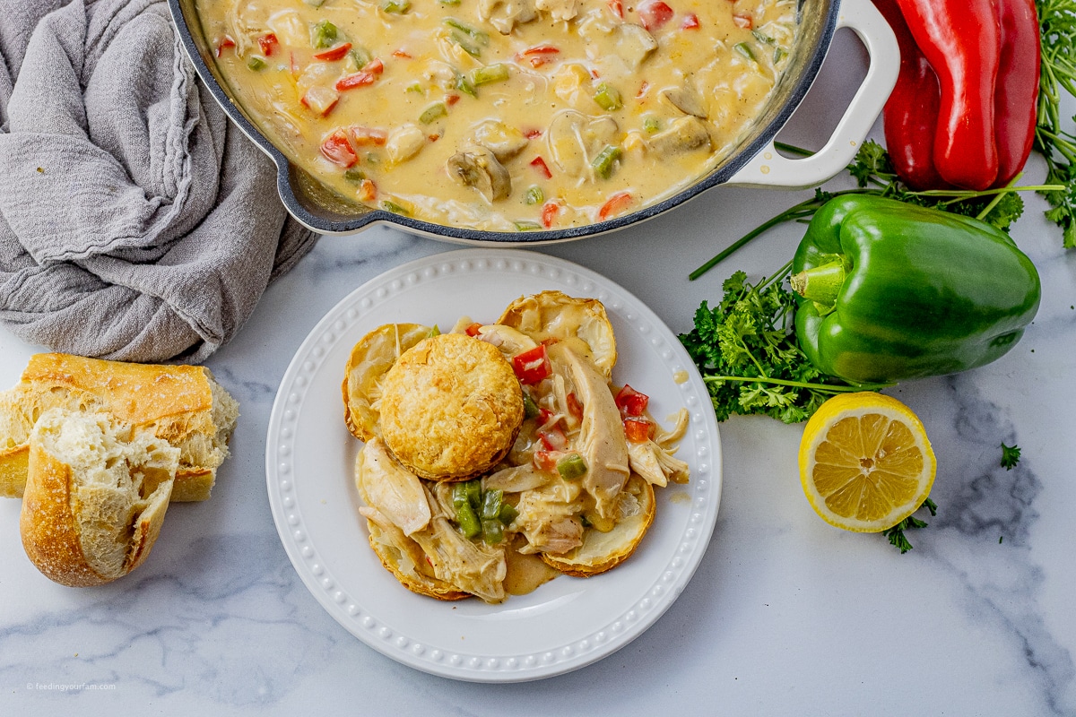 chicken a la king with green, red peppers and mushrooms topped with a puff pastry circle