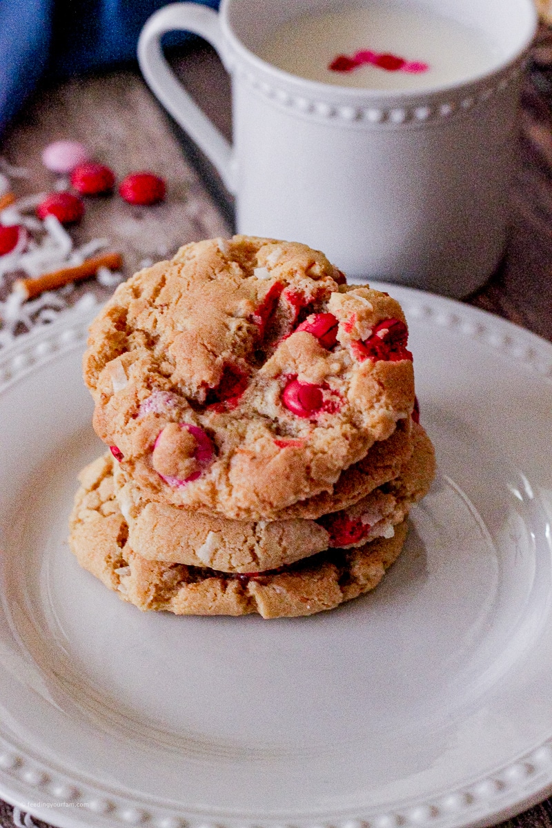 These Coconut Chocolate Crunch Cookies have a little bit of everything that makes them the most delicious cookie!! If you like coconut, chocolate, pretzels and just cookies in general, this is the cookie for you!! cookie made with red, pink and white m and m candies