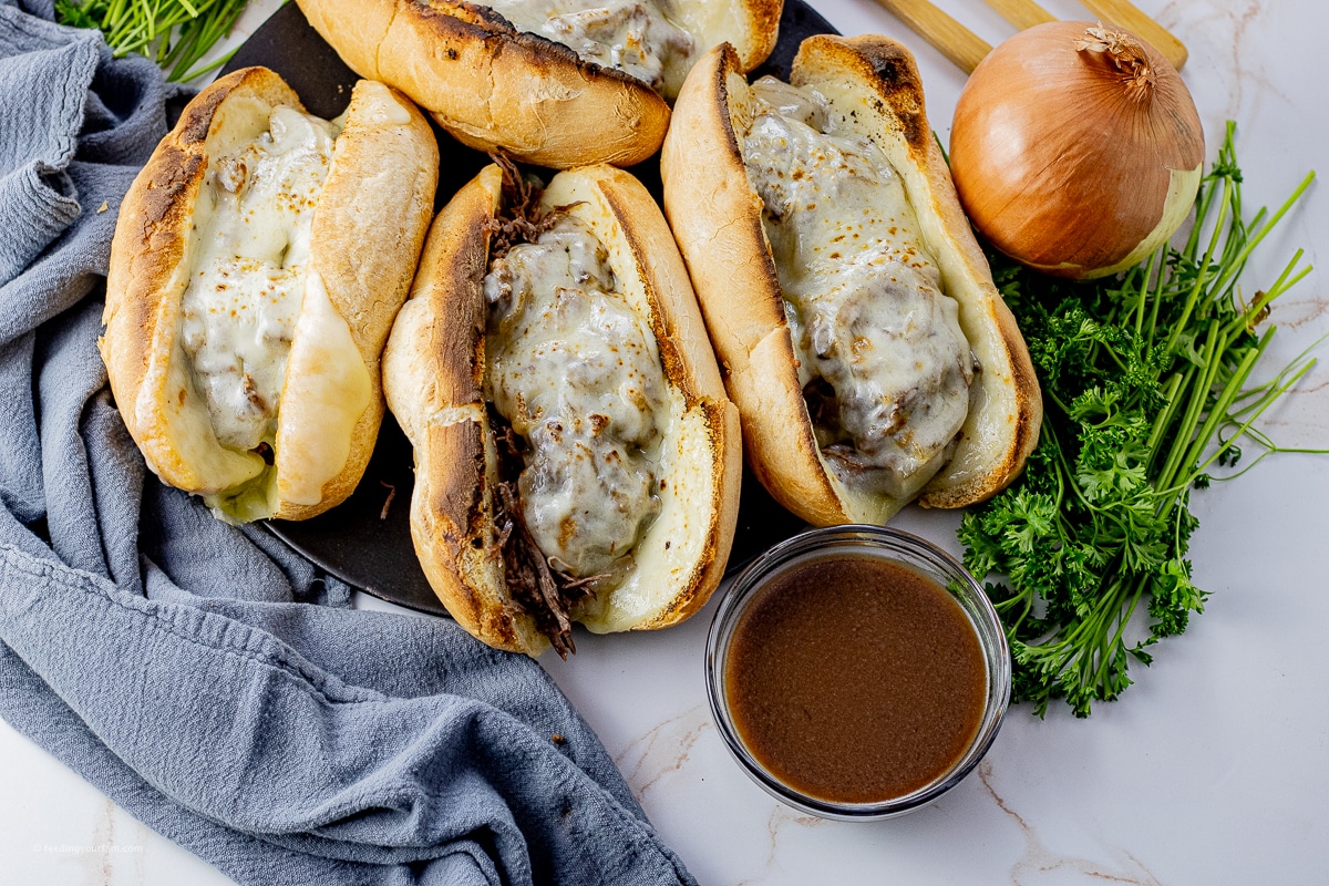 shredded beef in toasted buns topped with melted cheese