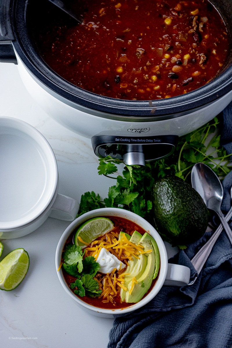 soup with beans, corn and ground beef cooked in a slow cooker 