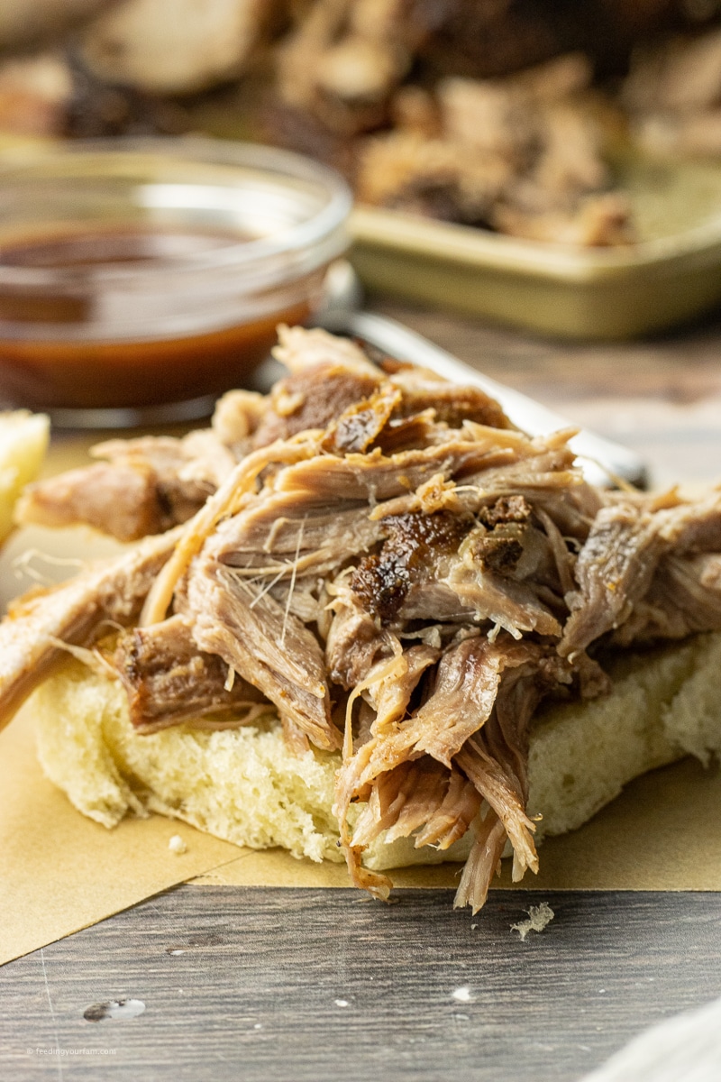 pulled pork on top of the bottom half of a bun