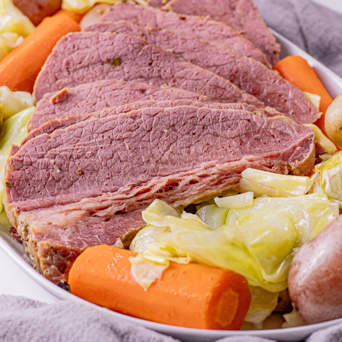sliced corned beef with carrots, cabbage and potatoes