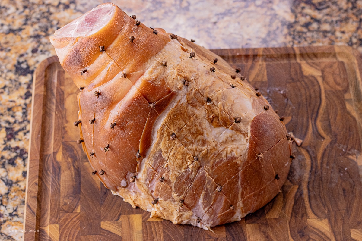 ham shank with whole cloves dotted on the outside