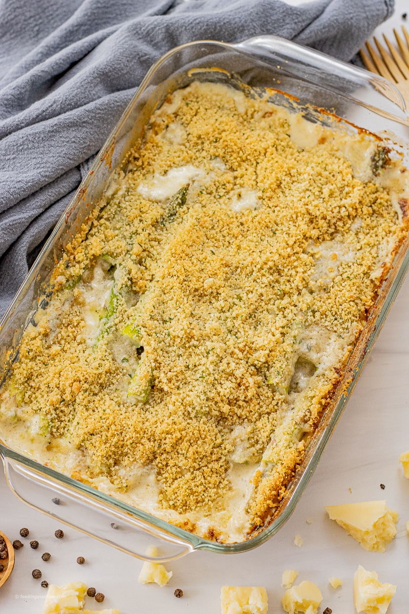 asparagus in a cream sauce topped with a breadcrumb topping